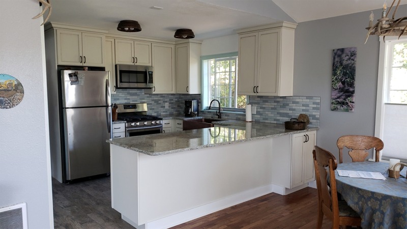 Kitchen Remodel with stainless appliances and tile backsplash